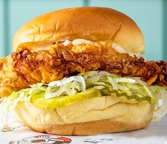 Crispy Chicken sandwich with Crispy Chicken Breast, Lettuce, Pickles, Lemon Aioli on a Potato Roll