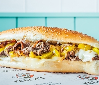 sub with Sliced Steak, Sauteed Onions, Provolone Cheese and Hot Banana Peppers