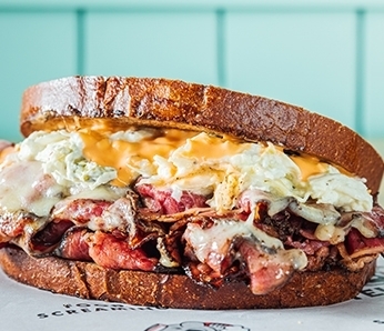 Hot Pastrami deli sandwich with Pastrami, Swiss Cheese, Coleslaw, Russian Dressing on Sliced Rye bread