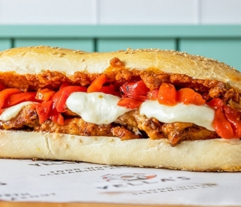 sub with Crispy Chicken Breast, Fresh Mozzarella, Roasted Peppers, Sundried Tomato Pesto on a Sub Roll