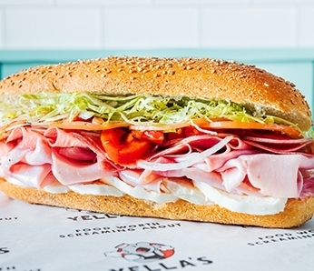 The Uncle Babe submarine sandwich with Deluxe Ham, Salami, Fresh Mozzarella, Roasted Peppers